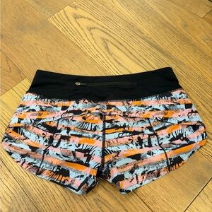 lululemon athletica Speed Up 2.5” Black, Orange, and Pink Patterned Shorts